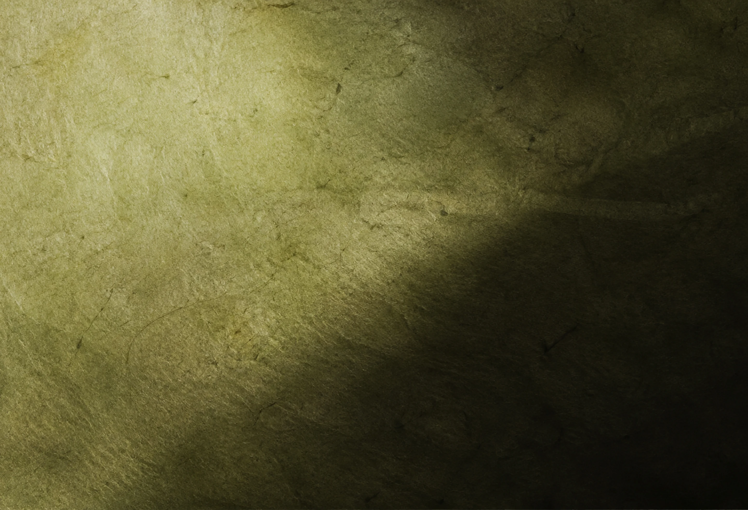 Textura de papel verde oliva con variaciones naturales de pigmento y luz.